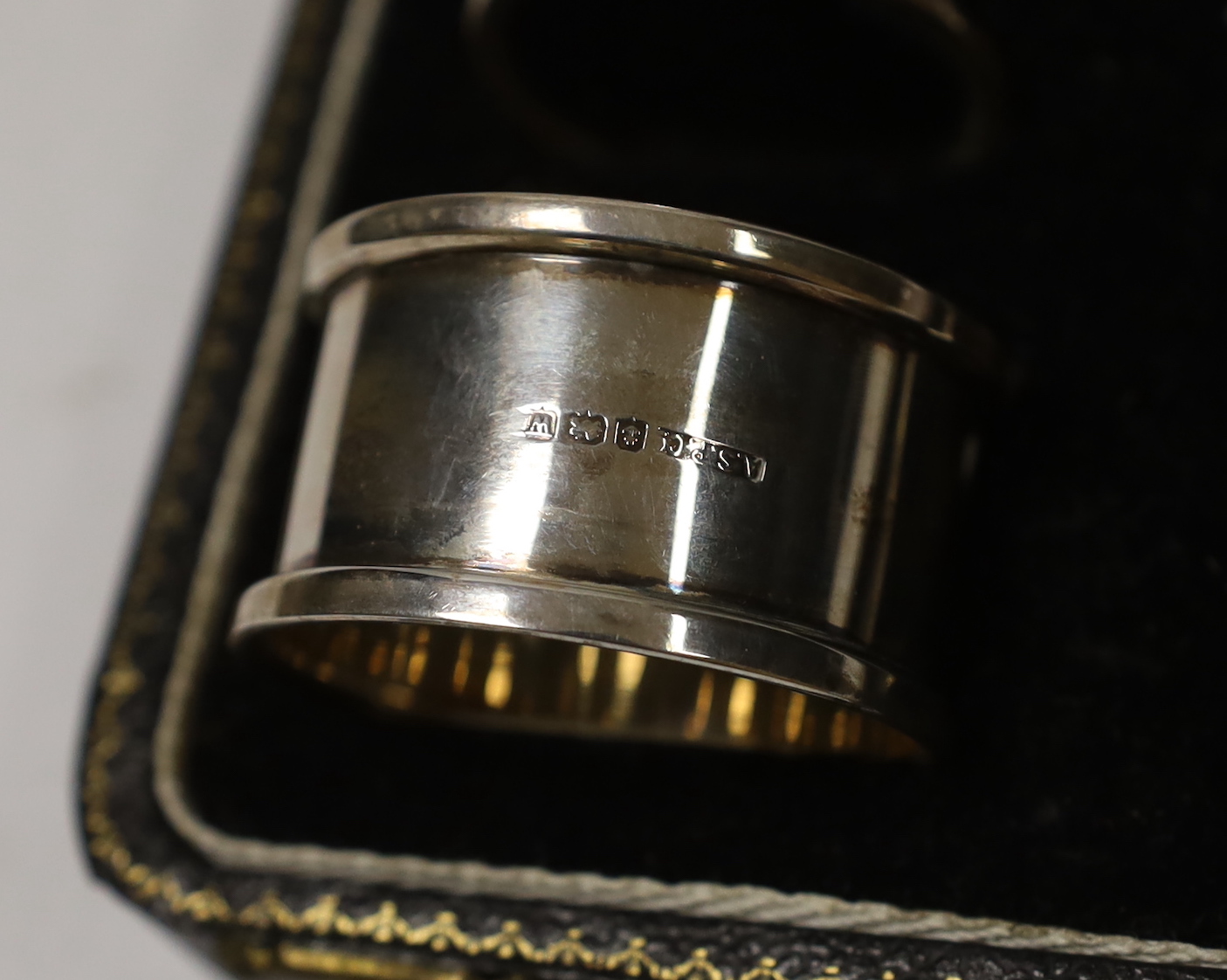 A cased George VI silver christening egg cup, spoon and napkin ring, Birmingham, 1946/7.